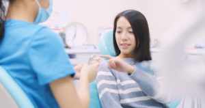 doctor dentist explain the implant of teeth to pat 2022 12 15 22 19 35 utc