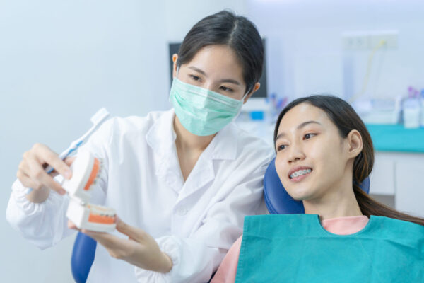 asian-woman-listening-dentist-explaining-about-tee-2021-12-09-21-04-06-utc (1)